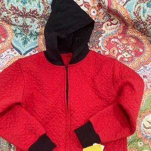 Quilted red jacket with Mickey Mouse silhouette on front.